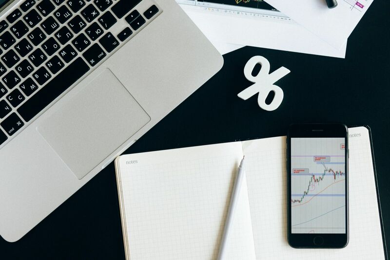 Charts, tickers, traders - Desk setup looking at stocks